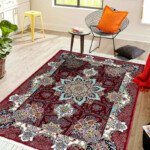 richly colored maroon Persian rug with intricate floral designs