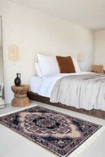 Beige Persian rug with intricate floral patterns and earthy tones, perfect for adding warmth and elegance to any room.