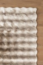 Beige shaggy area rug viewed from a different angle