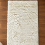 White fluffy shaggy rug for modern bedroom and living room décor