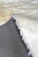 Thick pile and soft texture of a white shaggy rug