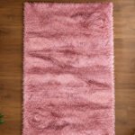 Pink shaggy rug displayed in a modern living room