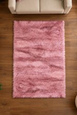 Pink shaggy rug displayed in a modern living room