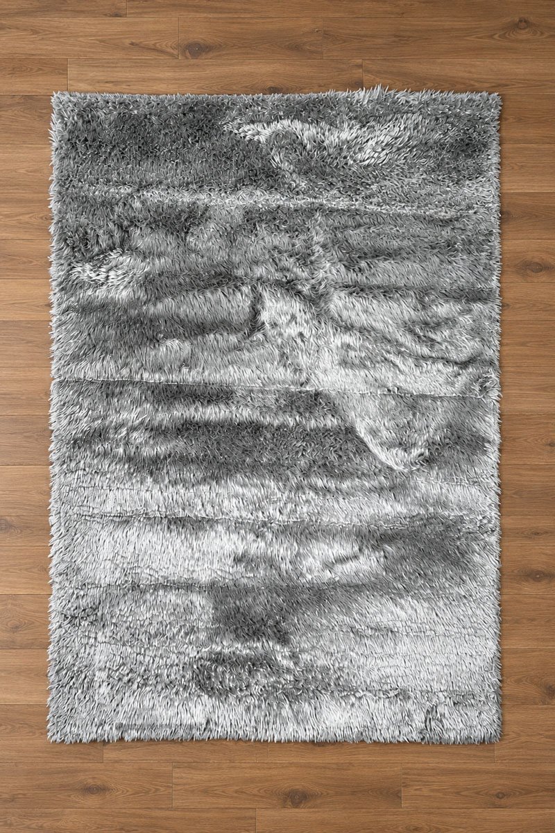 Furr shagy 6x7.5 rug 2a (1) Grey shaggy rug displayed in a modern living room