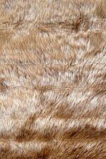 Detailed texture of a plush Brown shaggy rug