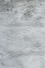 Grey shaggy rug with fluffy long pile for modern home décor