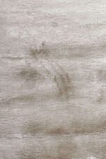 Plush pile and textured surface of a Ivory shaggy rug 3x5 ft