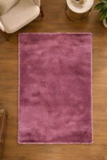 Pink shaggy rug displayed in a modern living room