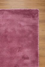pink shaggy area rug viewed from another angle