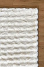 White shaggy area rug 3x5 ft viewed from another angle