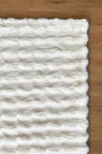 White shaggy area rug viewed from another angle