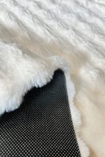 Thick pile and soft texture of a white shaggy rug 6x7.5 ft